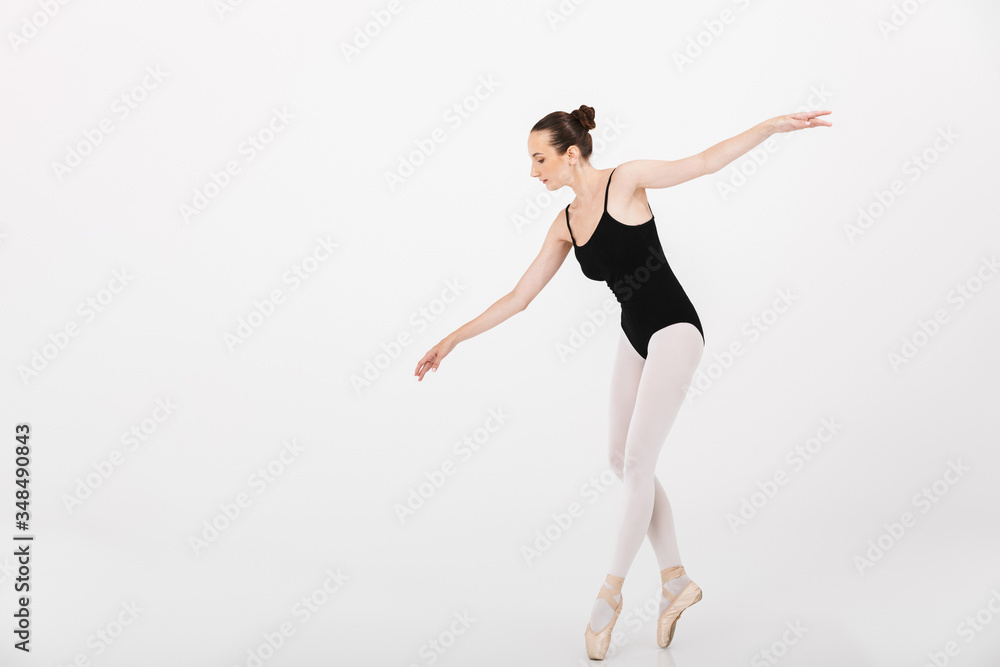 Image of caucasian woman ballerina practicing and dancing gracefully Image of caucasian woman ballerina practicing and dancing gracefully