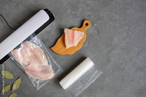 Vacuum packaging of fish. Extending the shelf life of products. Sous vide low temperature cooking products. photo