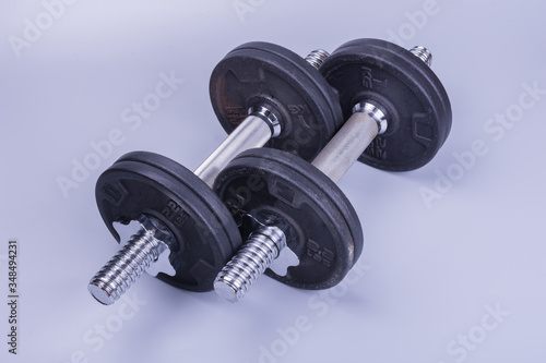 two athletic dumbbells for weightlifting