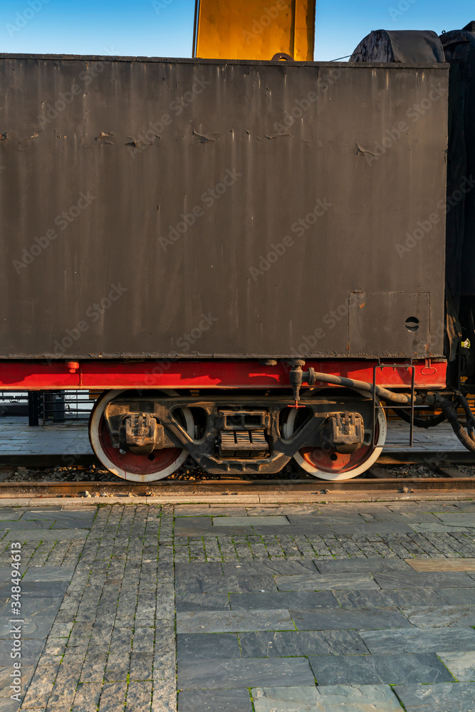 Old steam engine train and parts close-up