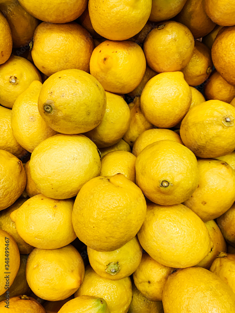 lots of ripe citrus yellow lemons for eating like a background lots of ripe citrus yellow lemons for eating like a background
