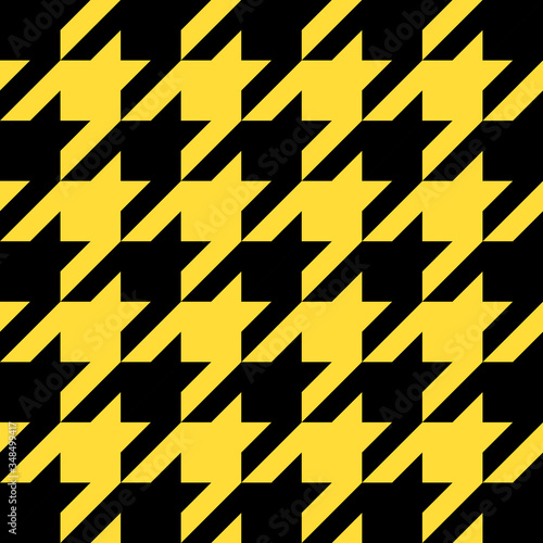 Goose foot. Pattern of crow's feet in black and yellow cage. Glen plaid. Houndstooth tartan tweed. Dogs tooth. Scottish checkered background. Seamless fabric texture. Vector illustration