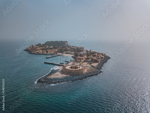 the island gore from which slaves were exported from Africa, turquoise water and yellow sand photographed from the air