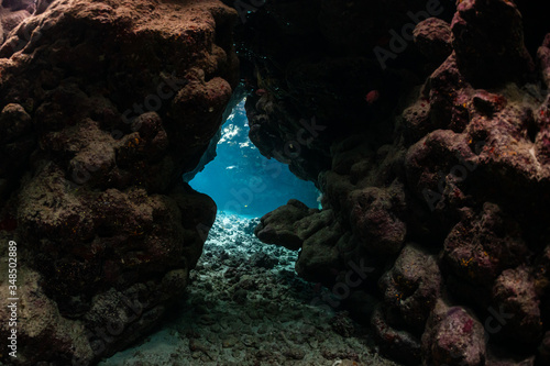typical underwater cave in a red sea reef
