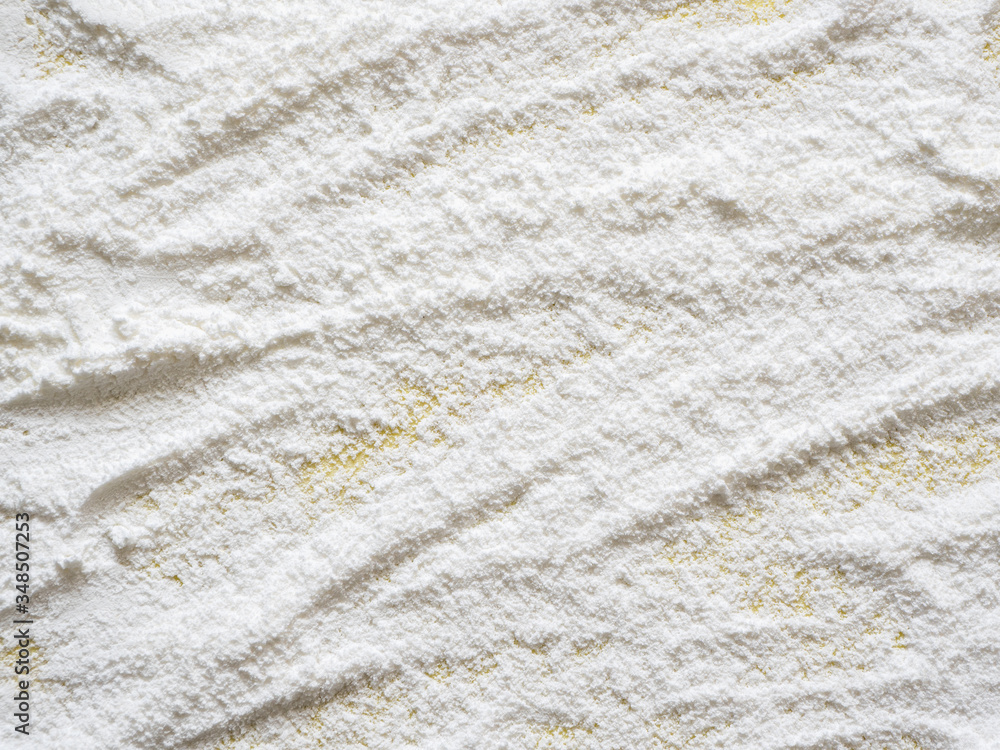 Baking background with flour, top view, close up Baking background with flour, top view, close up