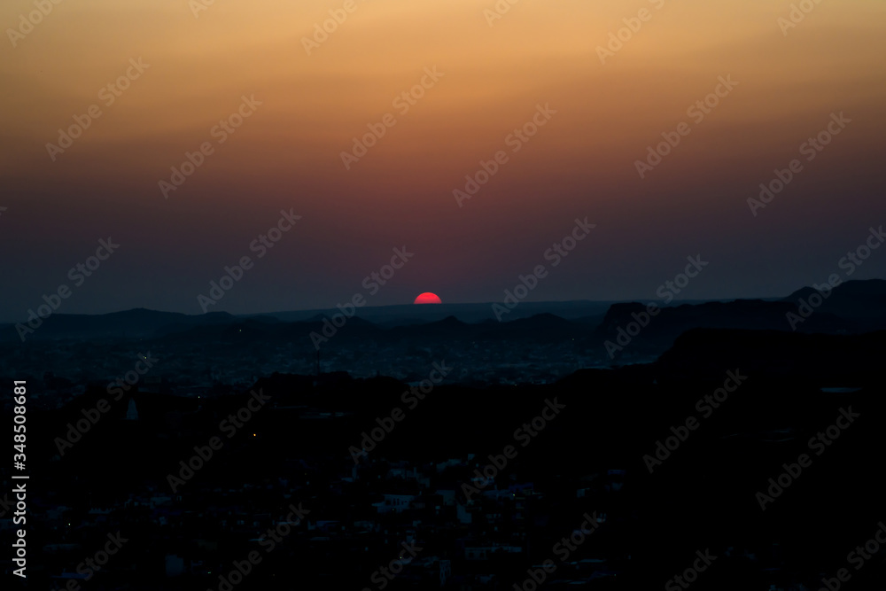 Obraz premium Sunset at Jodhpur city aerial view from top of Mehrangarh or Mehran Fort 