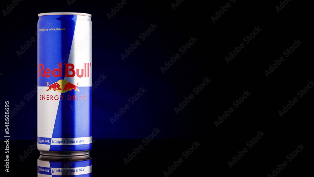 Red Bull can on dark toned background. Red Bull is an energy drink sold by  Austrian company. MINSK, BELARUS, May 13, 2020. Stock Photo | Adobe Stock