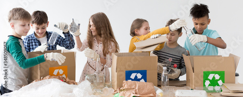 Group of kids happy to recycle together