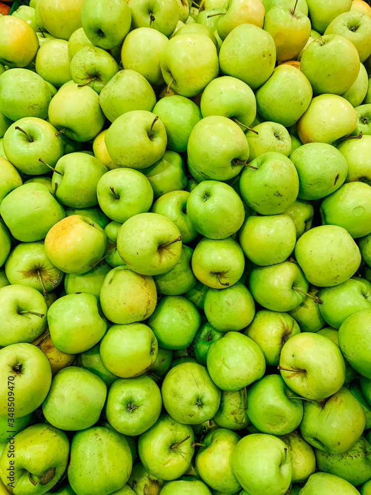 lots of ripe green sweet apples for eating like the background lots of ripe green sweet apples for eating like the background