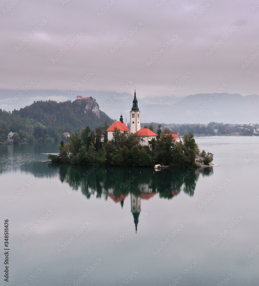 Morning view of famous lake Bled and small island with a church in Slovenia Morning view of famous lake Bled and small island with a church in Slovenia