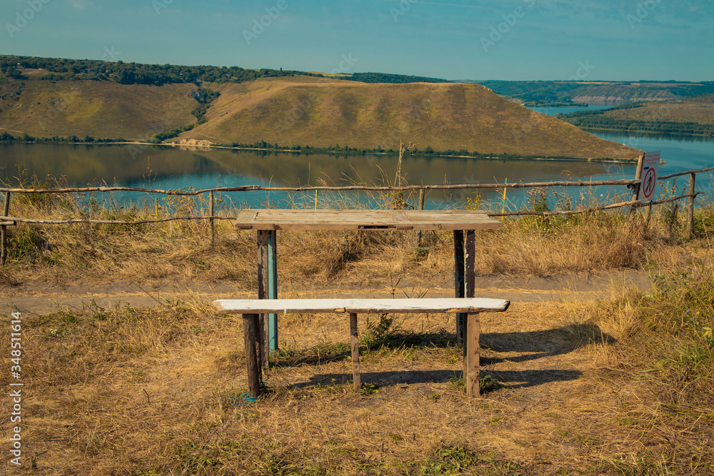 table stop point with scenic view on beautiful national park landscape river water stream between highland hills of Ukrainian Eastern European country side environment space in end of summer table stop point with scenic view on beautiful national park landscape river water stream between highland hills of Ukrainian Eastern European country side environment space in end of summer