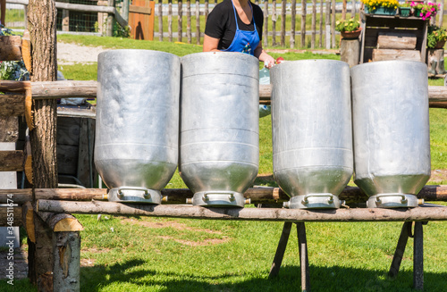 Milk churns ( milk can) at a mountain hut of the Vezzena pass Trento province, Trentino Alto-Adige, Italy, Europe.