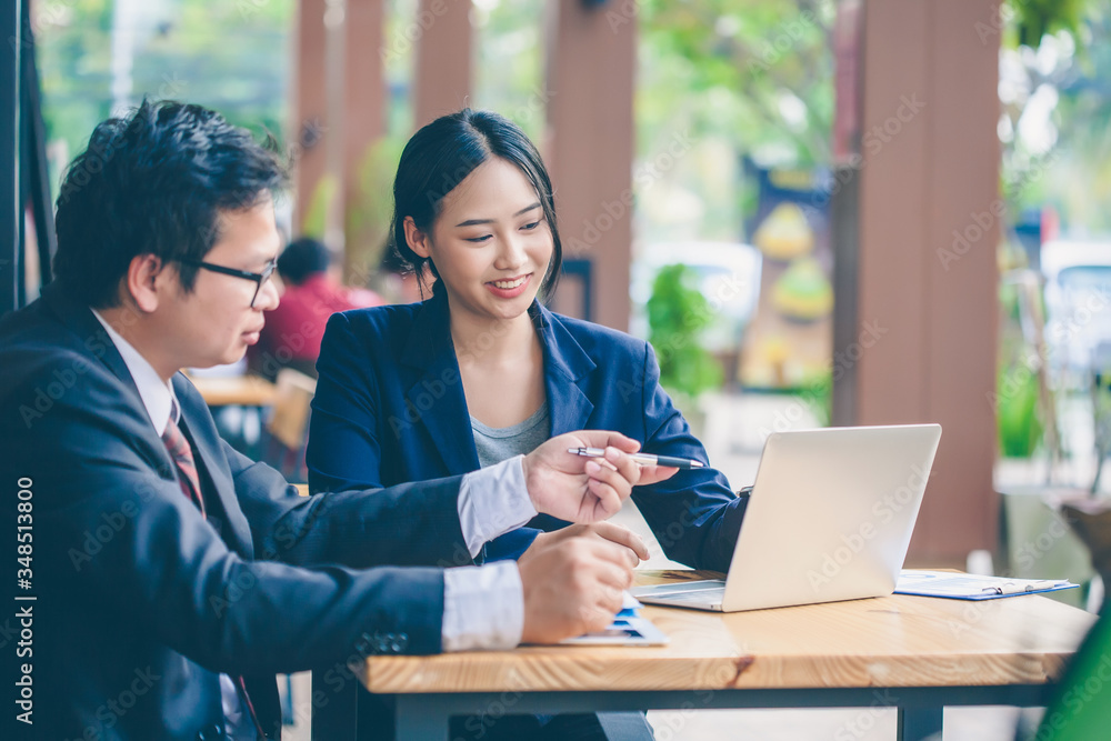 Asian business men are giving marketing advice to female customers. Business Strategy Consulting. Asian business men are giving marketing advice to female customers. Business Strategy Consulting.