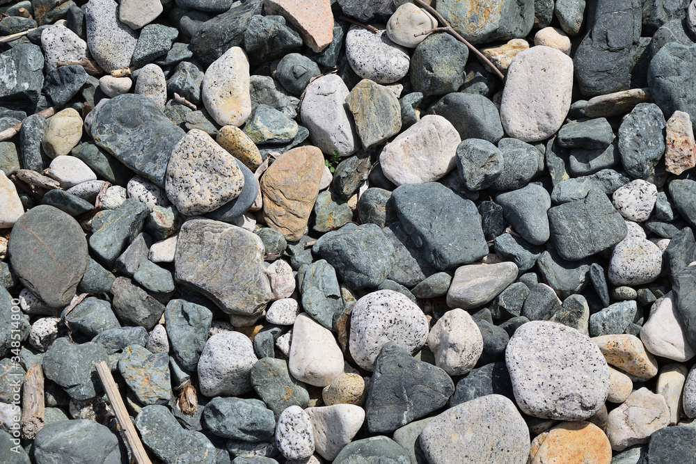 Pebbles on the beach in Samothraki island, Greece, Aegean sea. Sea rocks. Background, Texture