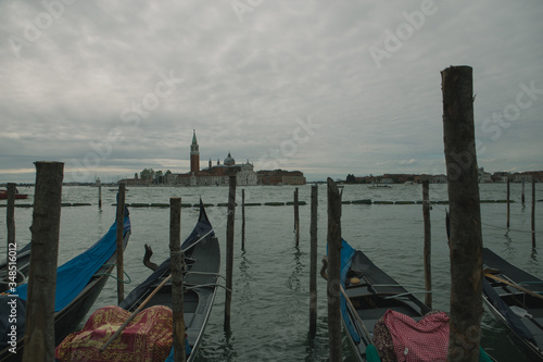 gondolas in Venice, Italy. gloomy, cloudy day. quarantine © coolnina