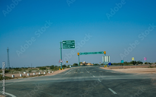 Highway, path, road in Desert of Rajasthan, India. Road passing through a landscape, Jodhpur, Rajasthan, India