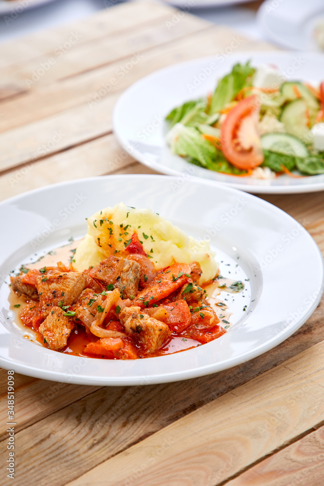 chicken with mashed potatoes and salad on the wooden background chicken with mashed potatoes and salad on the wooden background