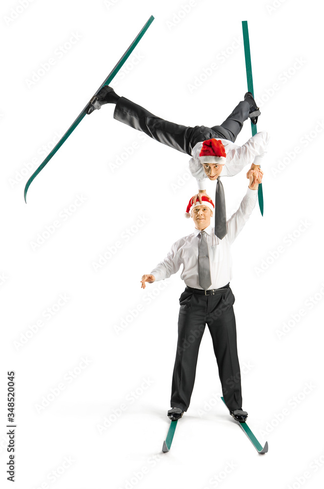 Business acrobats balancing in various poses on a white background.