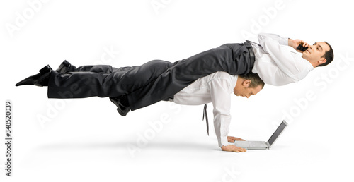 Φωτογραφία Business acrobats balancing in various poses on a white background