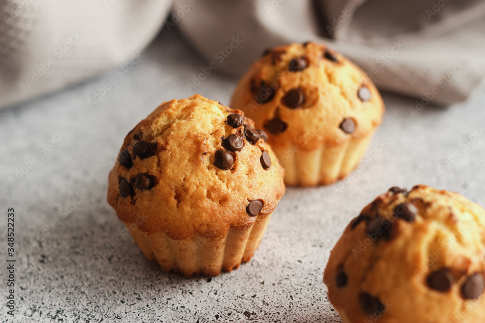 Delicious orange muffins with chocolate. Muffins on the table