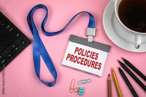 POLICIES and PROCEDURES concept. Staff Identity, cup of coffee and black computer keyboard