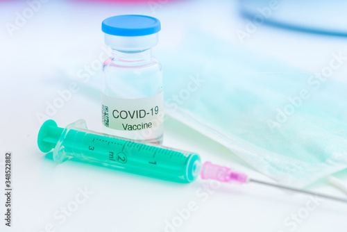 Nobel coronavirus covid-19 vaccine vial, in a biological laboratory with a biological tube for analysis and sampling of Covid-19 infectious disease.