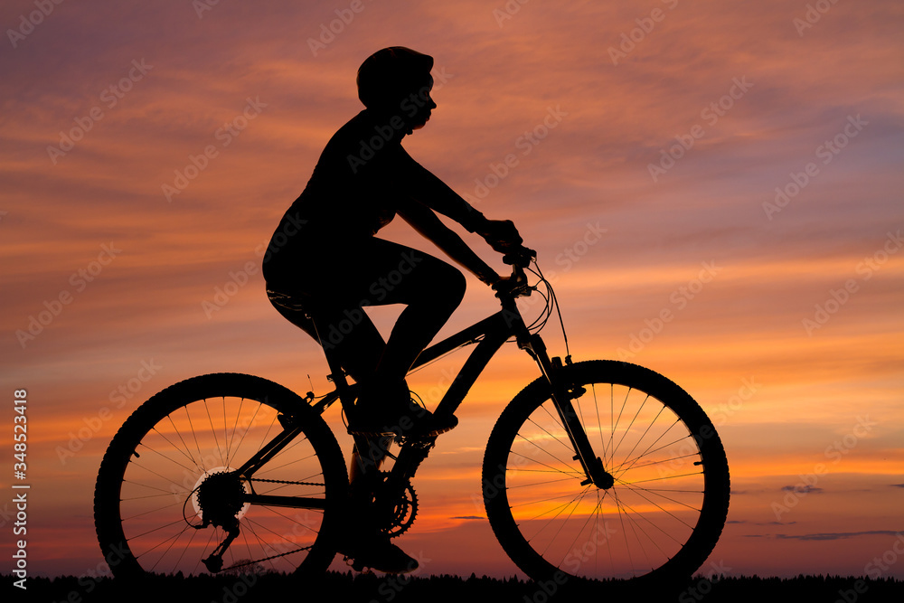 silhouette of a cyclist against the sunset silhouette of a cyclist against the sunset