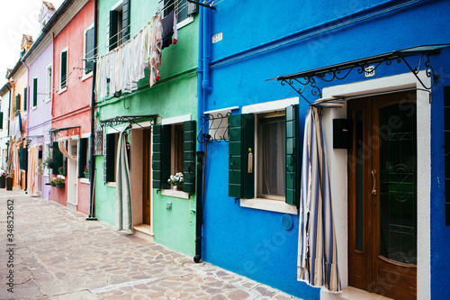 Colorful houses taken on Burano island , Venice, Italy in summer time. Positive color makes beautiful background © coolnina