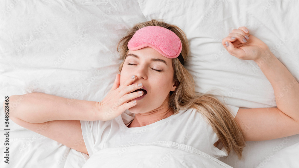 Fototapeta premium Woman yawning and being sleepy