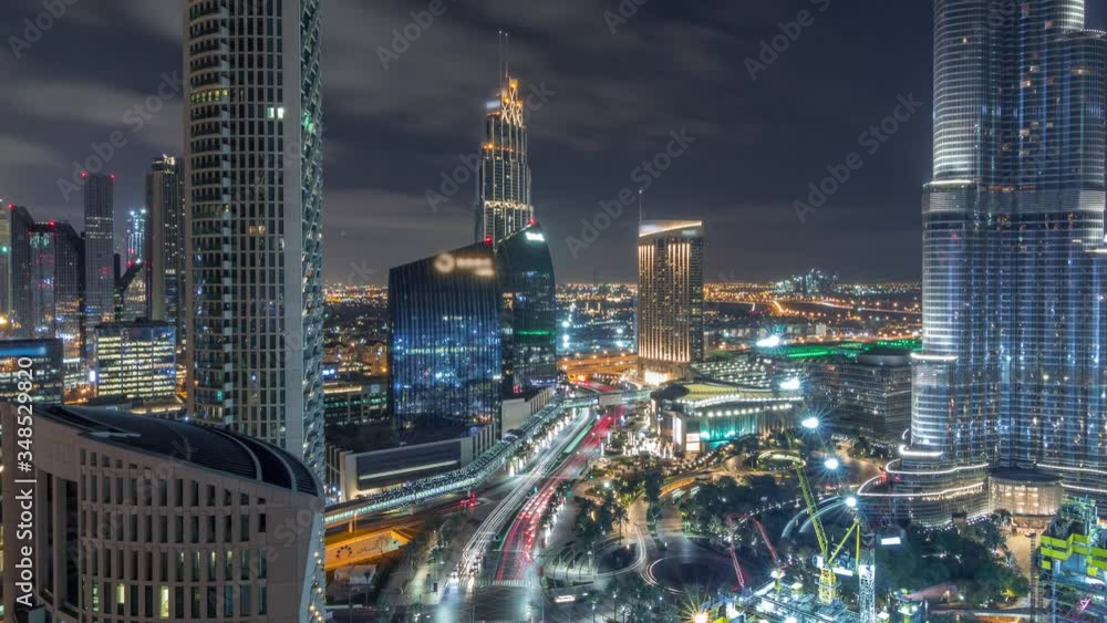 custom made wallpaper toronto digitalPanoramic skyline view of Dubai downtown with mall, fountains and Burj Khalifa aerial timelapse during all night with lights swithcing off. Modern illuminated skyscrapers and construction site