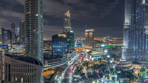 Wallpaper Mural Panoramic skyline view of Dubai downtown with mall, fountains and Burj Khalifa aerial timelapse during all night with lights swithcing off. Modern illuminated skyscrapers and construction site Torontodigital.ca