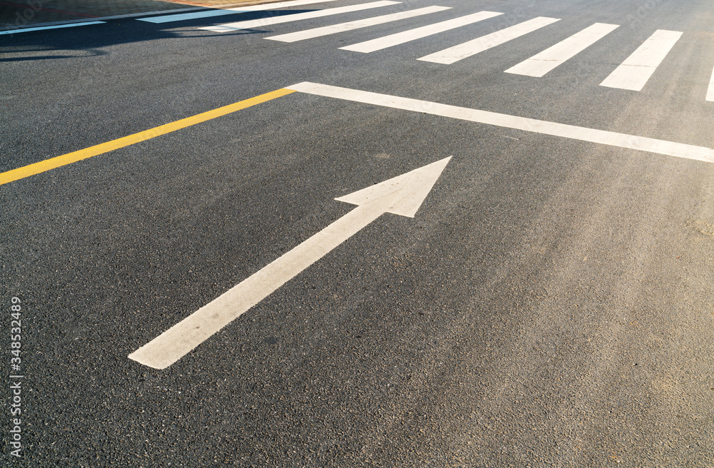 White arrow symbol on the ground White arrow symbol on the ground
