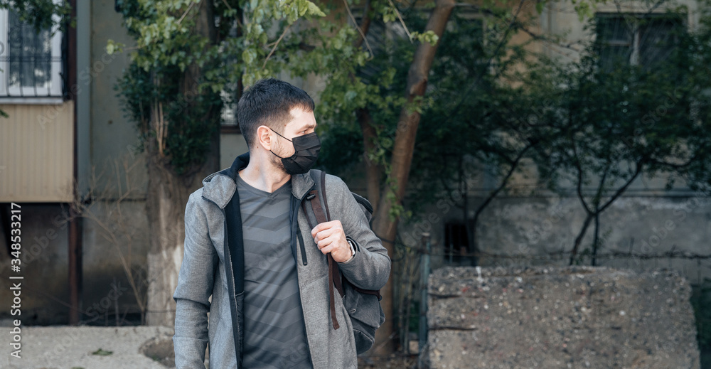 young man in a protective mask