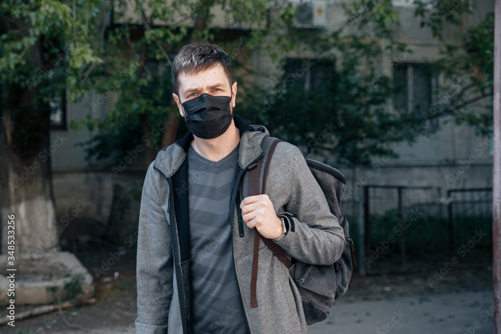 young man in a protective mask young man in a protective mask