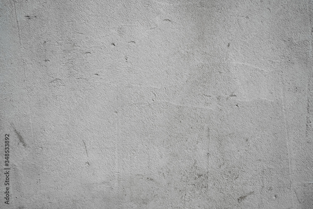 Fototapeta premium Gray concrete background. Concrete pavement texture. Place for text on a gray background.