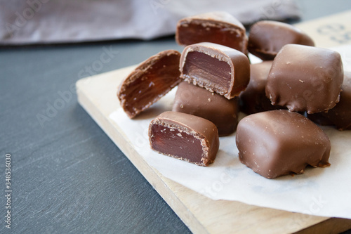 Turkish sweets (Turkish delight) in chocolate on a gray background