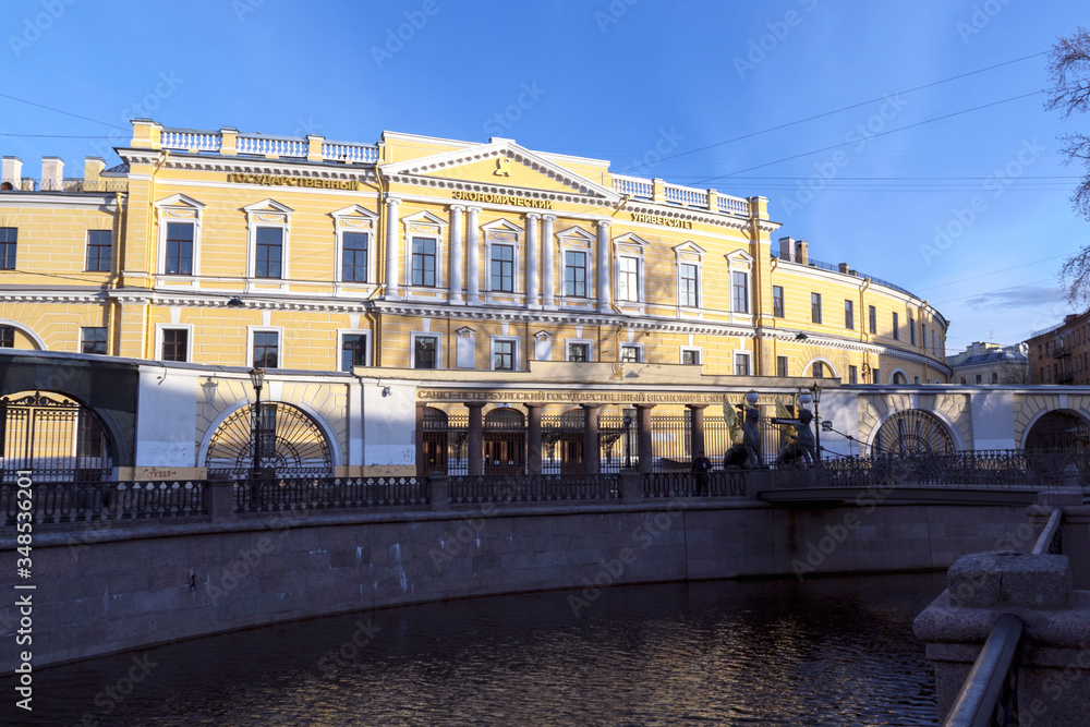 RUSSIA, SAINT PETERSBURG-April 2020: Saint Petersburg State University of Economics, Bank bridge and part of the embankment of the Griboyedov canal
