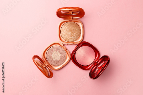 Set of professional elite decorative cosmetics for makeup on a pink background. The concept of beauty and fashion. Mua and girly concept. Eye shadows cosmetics product as luxury beauty brand promotion