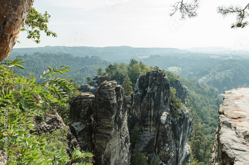Landscape of Sandstone Rocks in Saxon Switzerland in summer morning, look in the morning. Germany, Dresden. Vertical. Untouched rocky mountains.