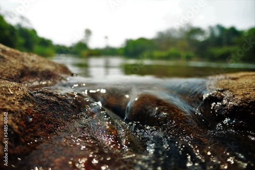 Wallpaper Mural water flowing over rocks Torontodigital.ca