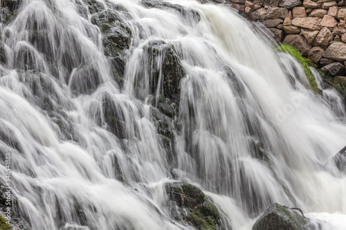 A waterfall in a forest in central Sweden photographed by a long exposure.