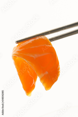 salmon sashimi and chopsticks