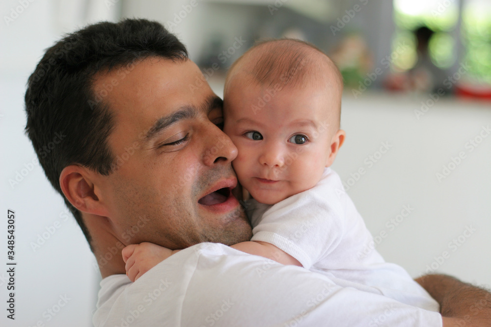 father plays with his beautiful baby, narrow focus father plays with his beautiful baby, narrow focus