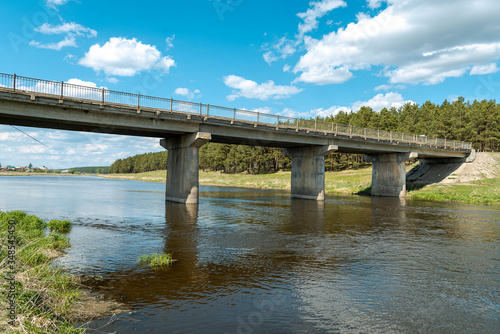 Concrete auto bridge over the river © Николай Моос