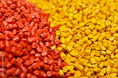 Red and yellow plastic polymer granules 