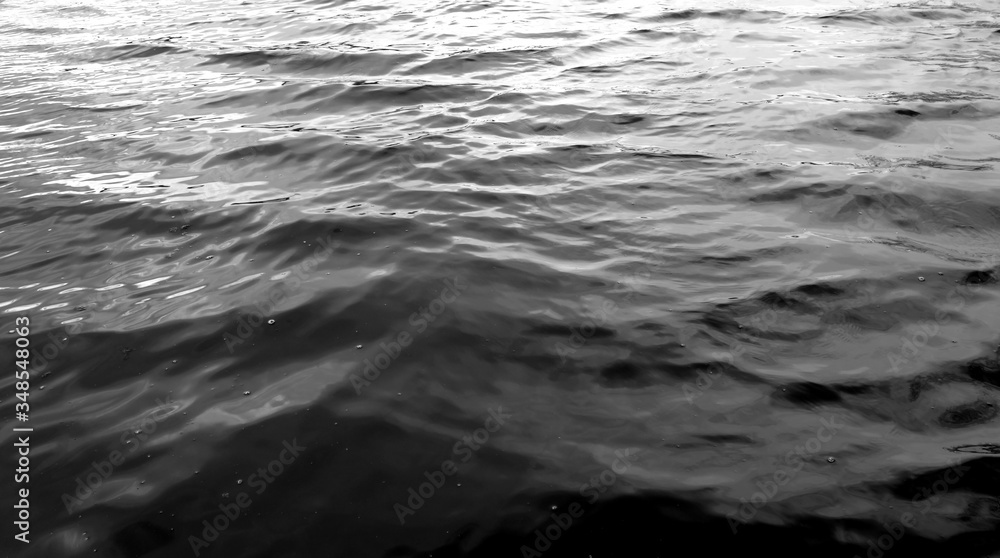 Waves on lake water surface. Black and white