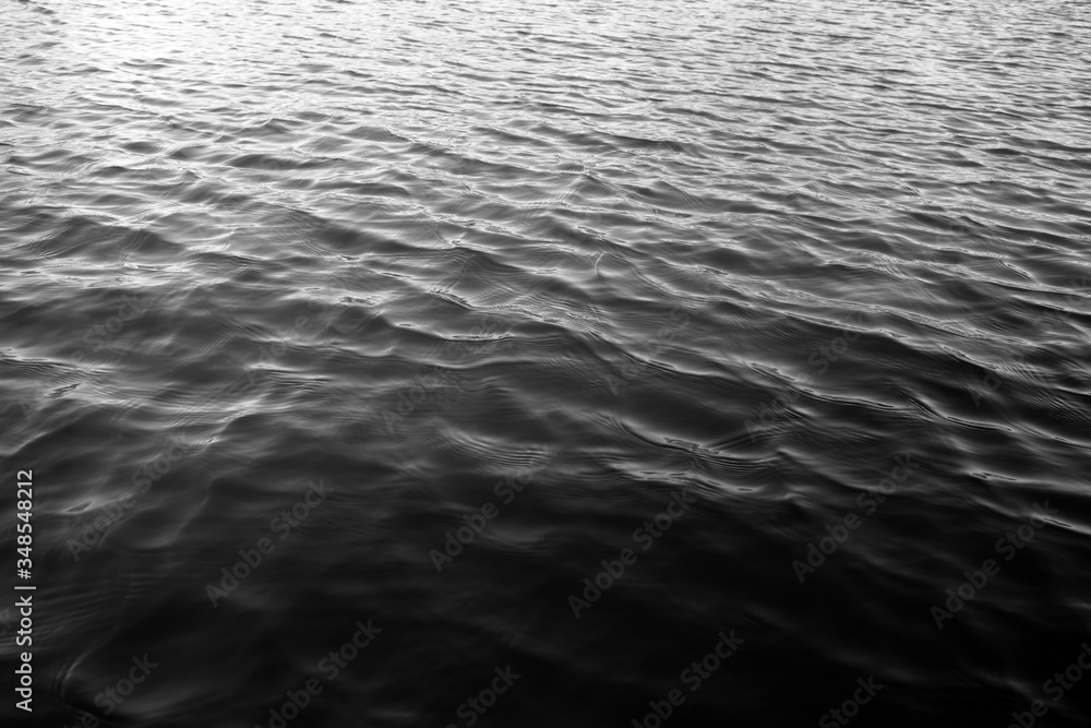 Waves on lake water surface. Black and white Waves on lake water surface. Black and white