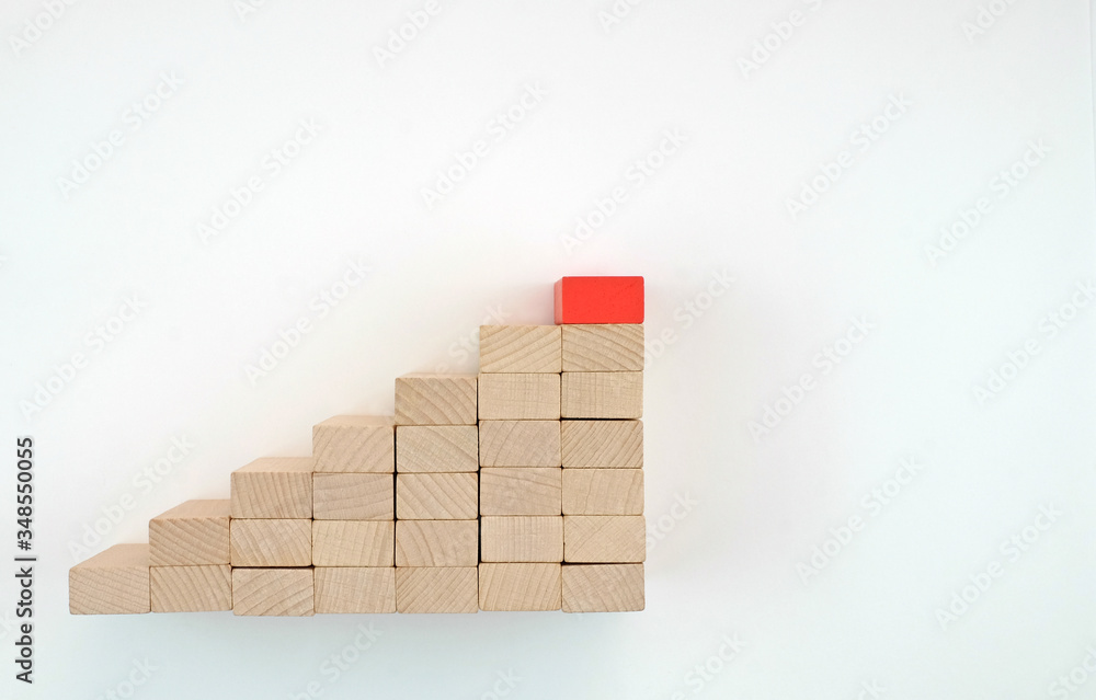 Business concept growth up of wood blocks with red top Business concept growth up of wood blocks with red top