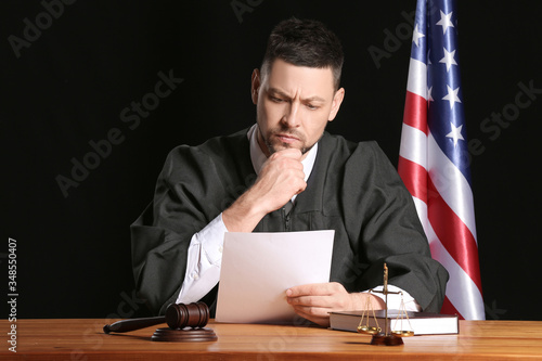 Male judge reading document...