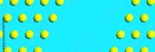 Trendy pattern made of tennis ball on blue green mint background. Sport tennis layout. Flat lay.